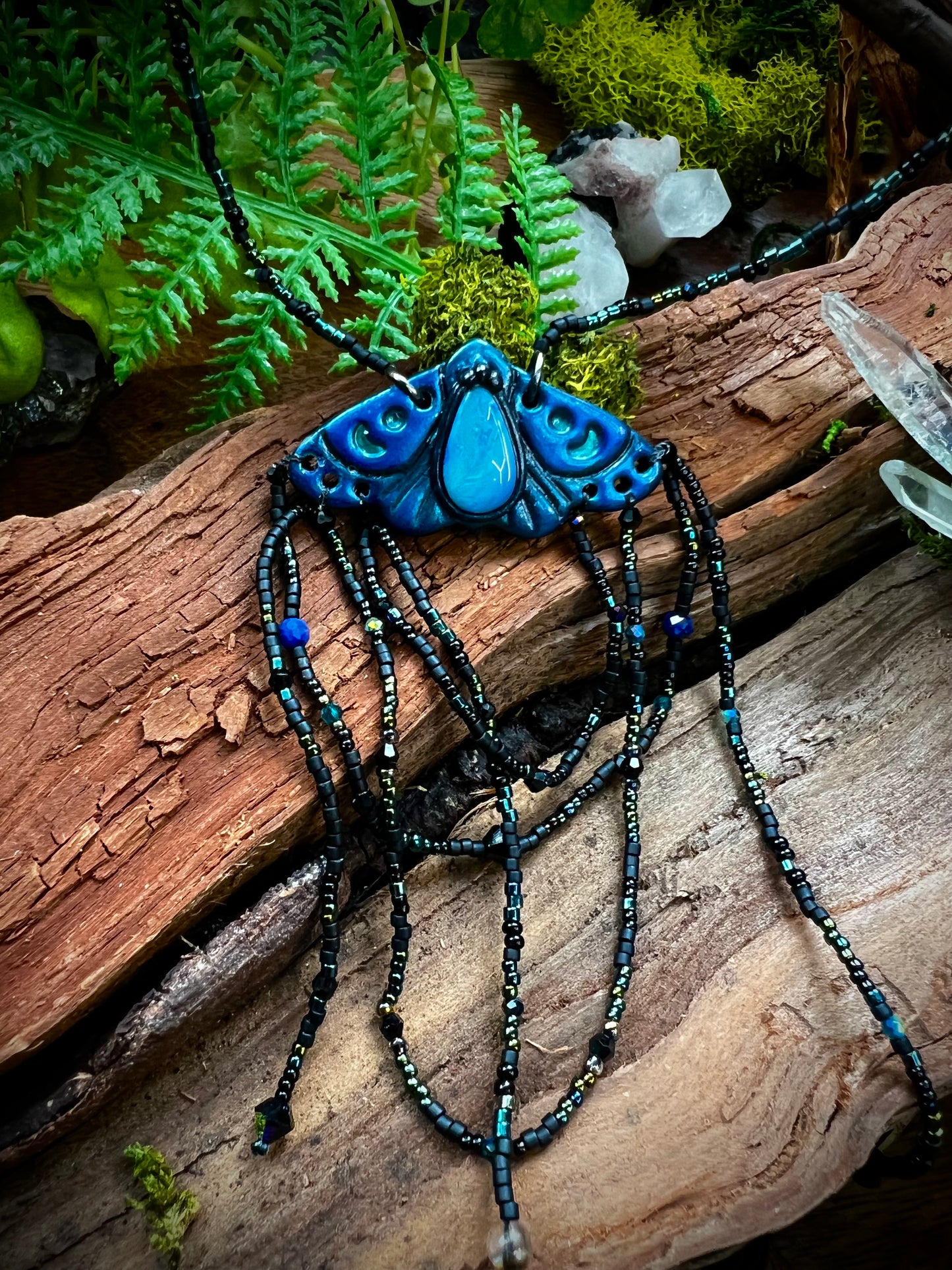 Artisan moth statement necklace symbolizing transformation and divine connection