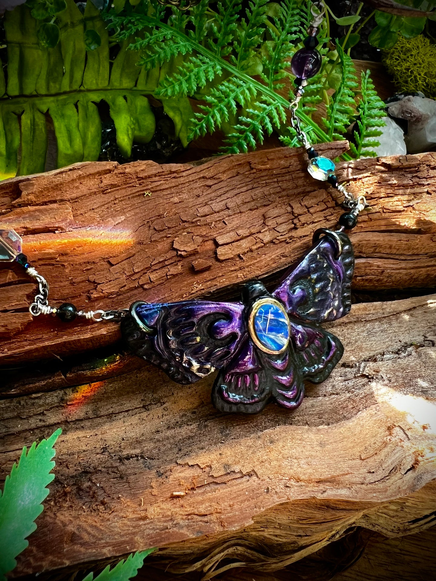Artisan opal moth necklace symbolizing transformation and divine light