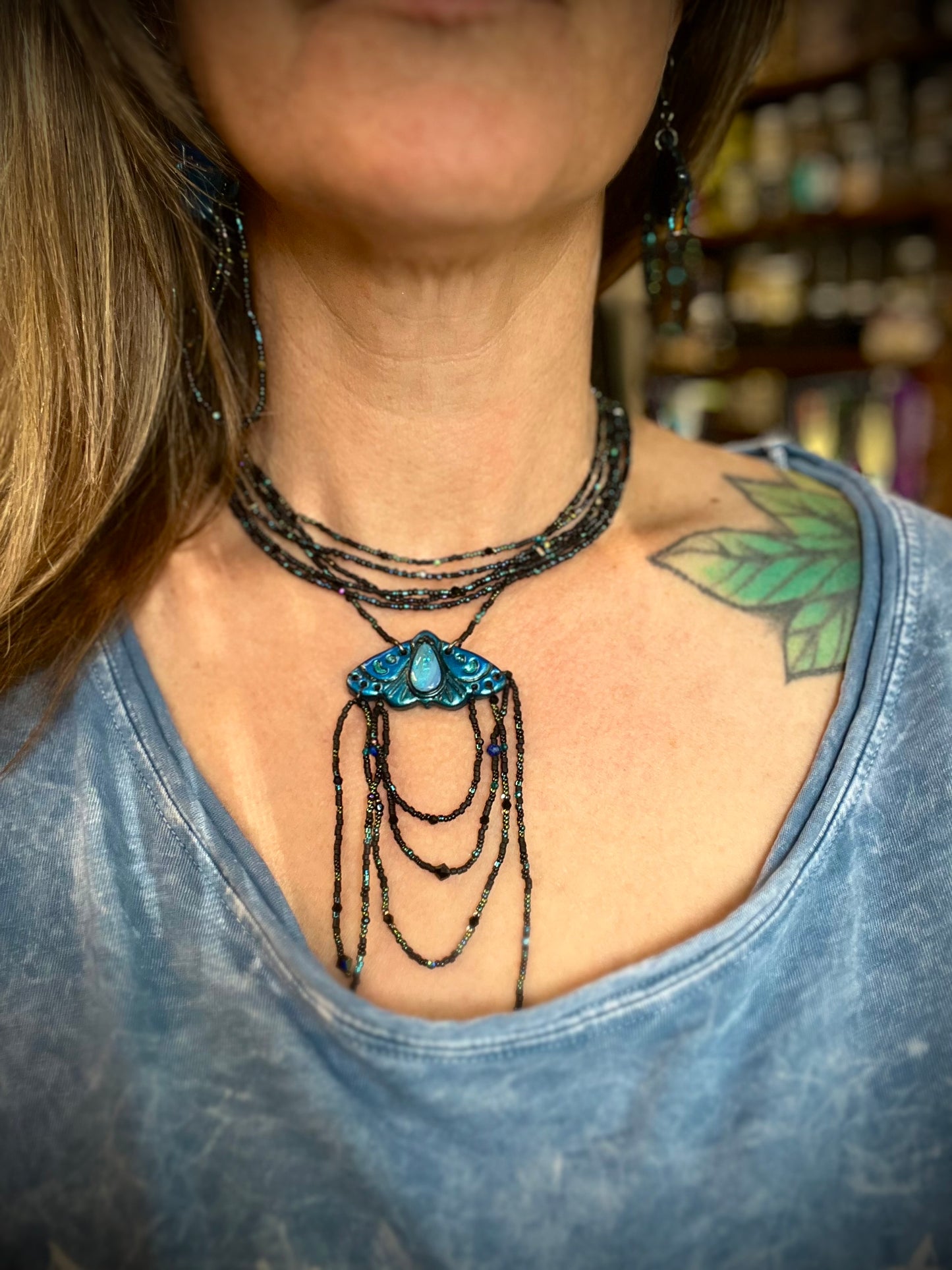 Australian opal moth necklace with flowing seed bead strands