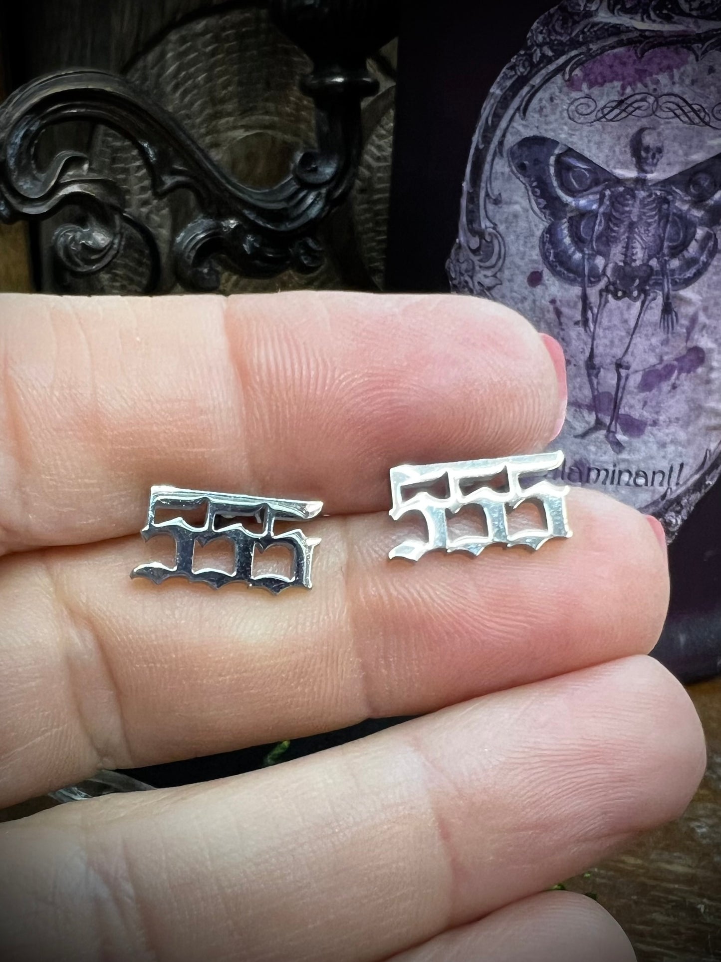 Numerology 555 stud earrings on with magical background