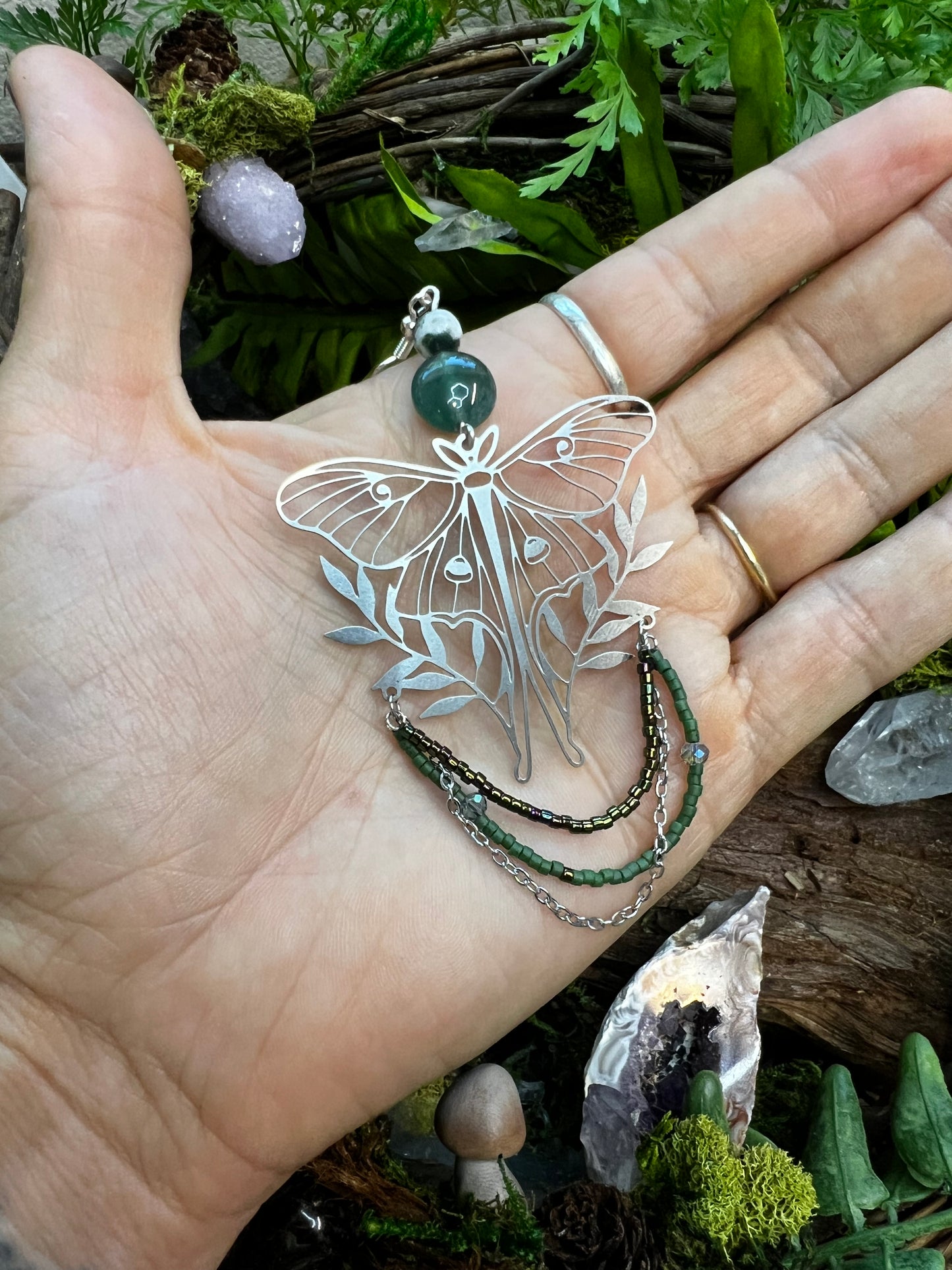 Bold yet elegant moss agate earrings with forest-inspired moth and chain details