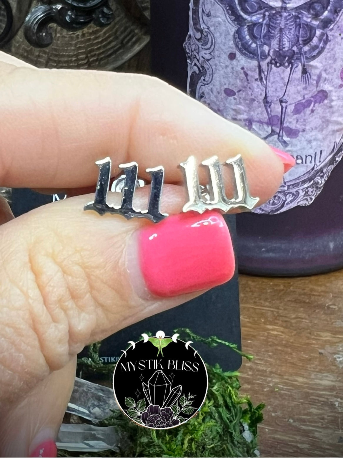 Minimalist numerology 111 earrings shown with enchanted altar background