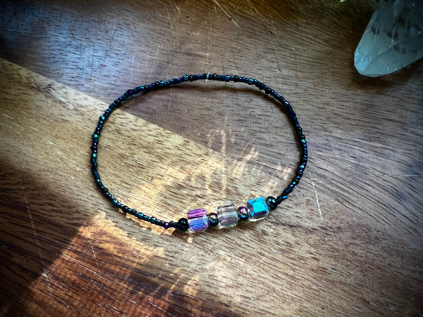 Iridescent aurora crystal bracelet with shimmering rainbow glow
