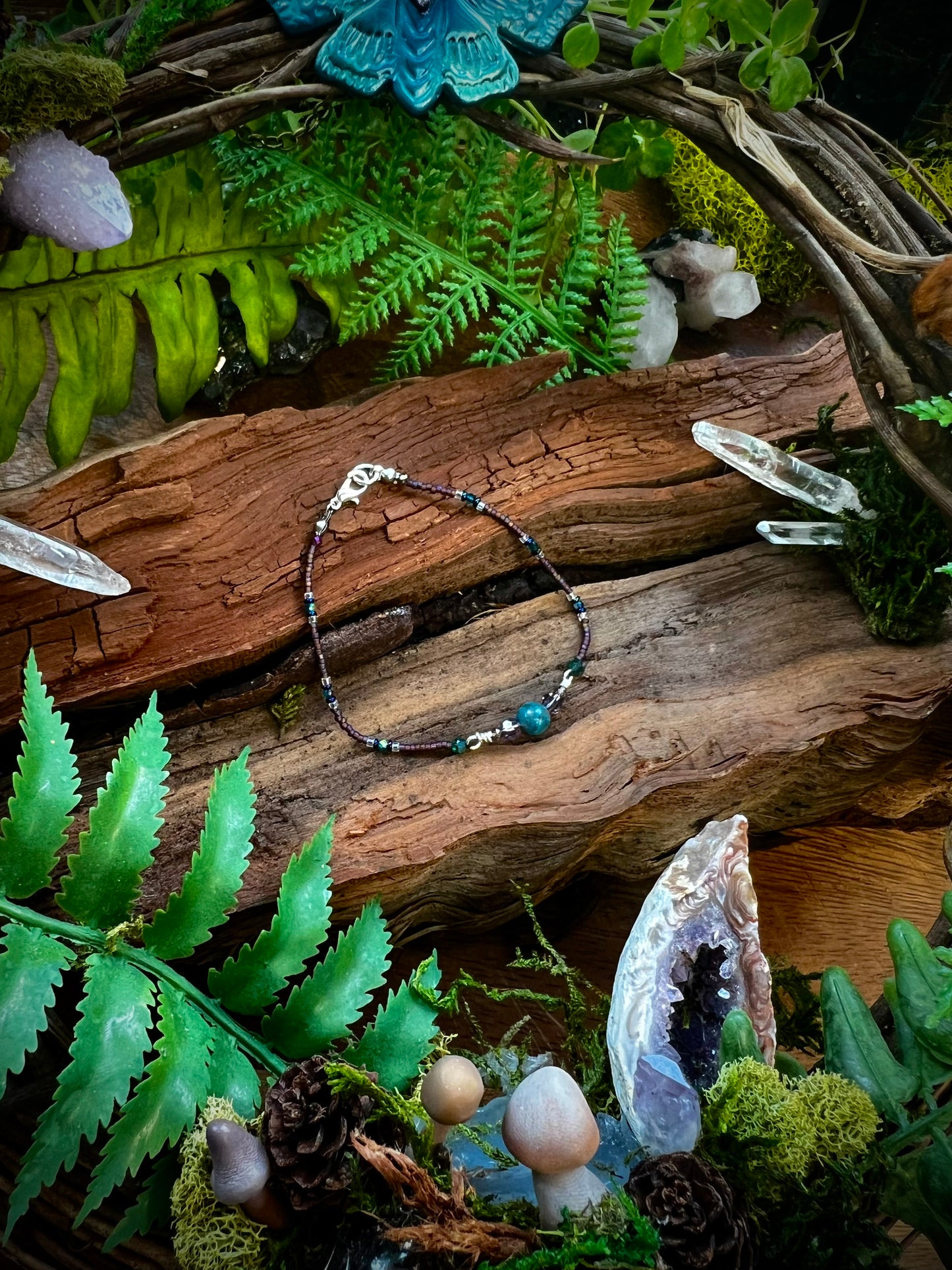Handcrafted apatite bracelet displayed on rustic wood background