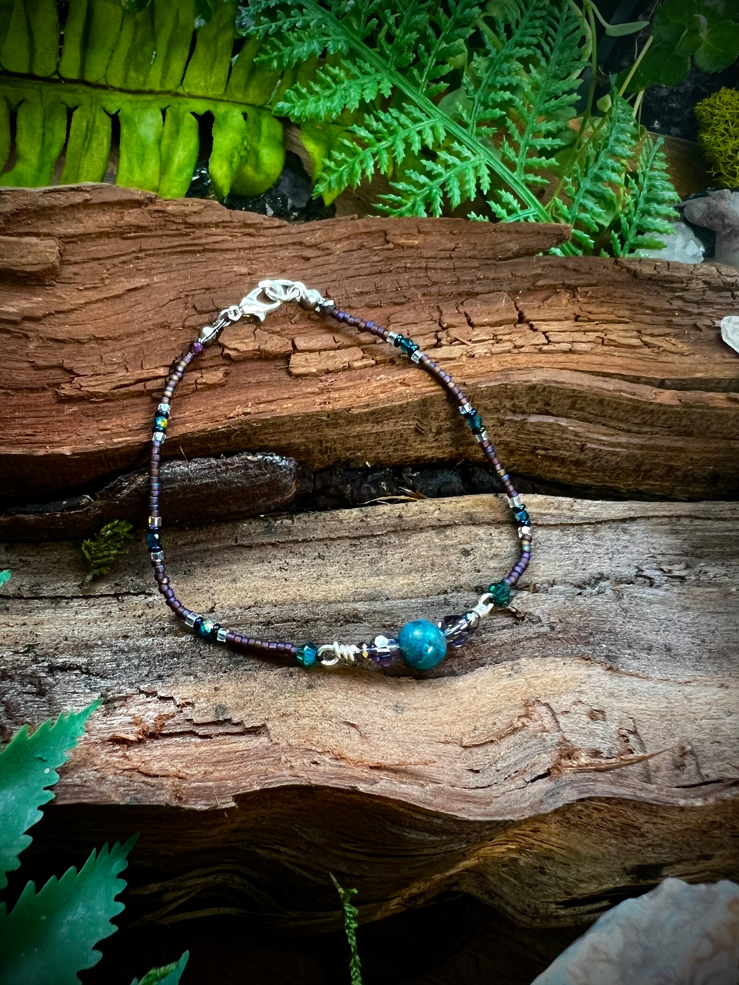 Mystical apatite gemstone bead glowing in bracelet design