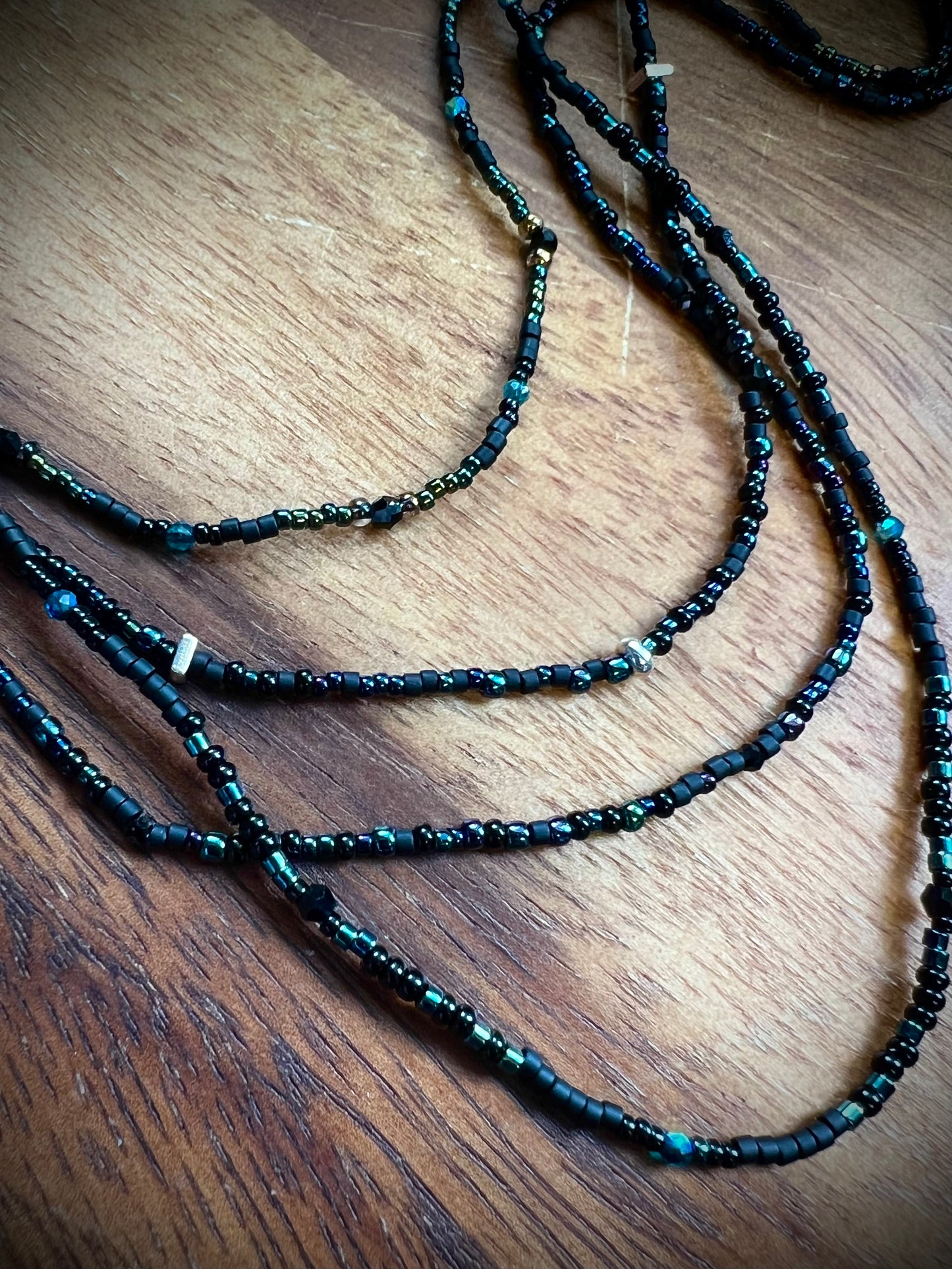 Group shot of 4 Moonlit Dreams Seed Bead Necklaces – dainty layering strands with aurora crystals