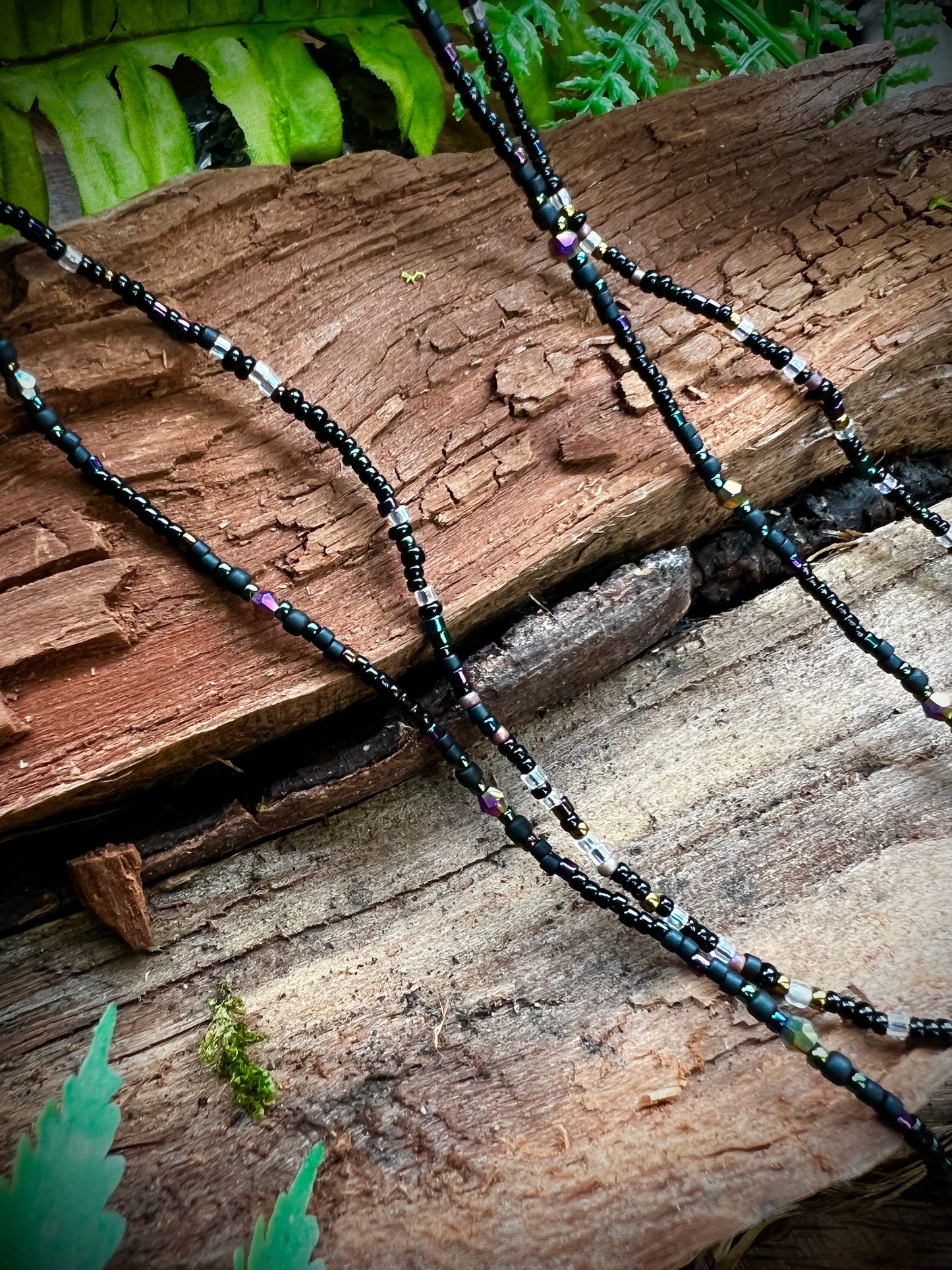 Two variations of aurora seed bead necklaces, patterned and random