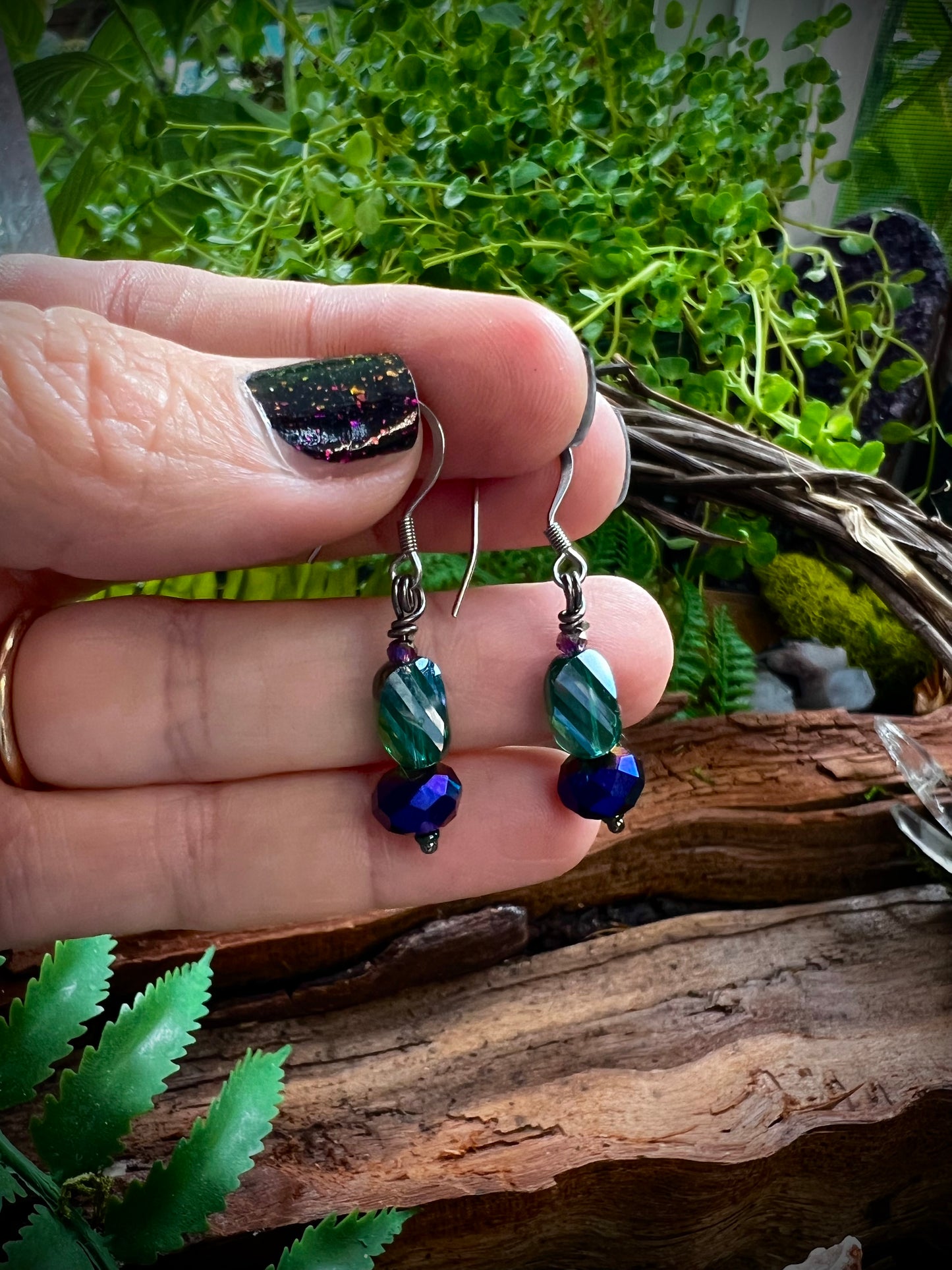 Lightweight fairycore earrings with rainbow shimmer displayed on hand