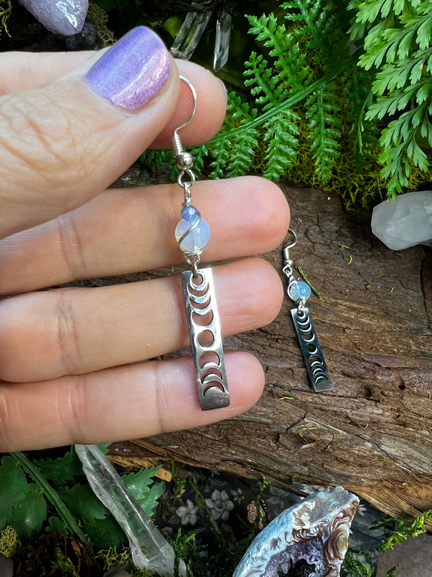 Mystical moon phase earrings with glowing opalite and soothing kyanite on rustic wood