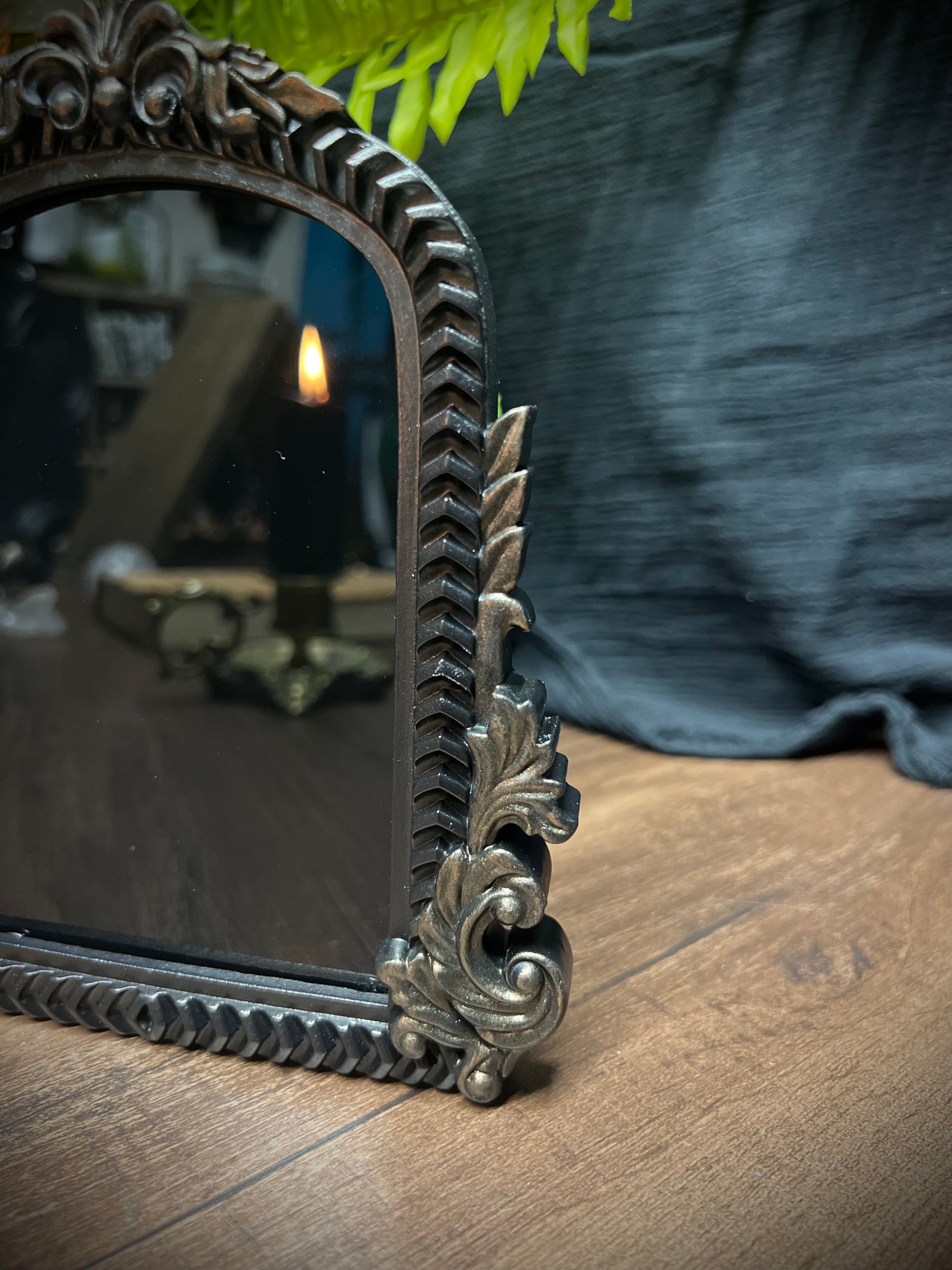 Small Fancy Black Scrying Mirror Ornate Scrolls Black and Bronze Detail on a Witch’s Altar Divination Magickal Mirror