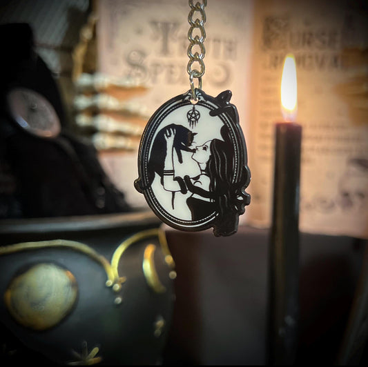 Witchy keychain with fancy victorian frame and gothic woman holding a black cat
