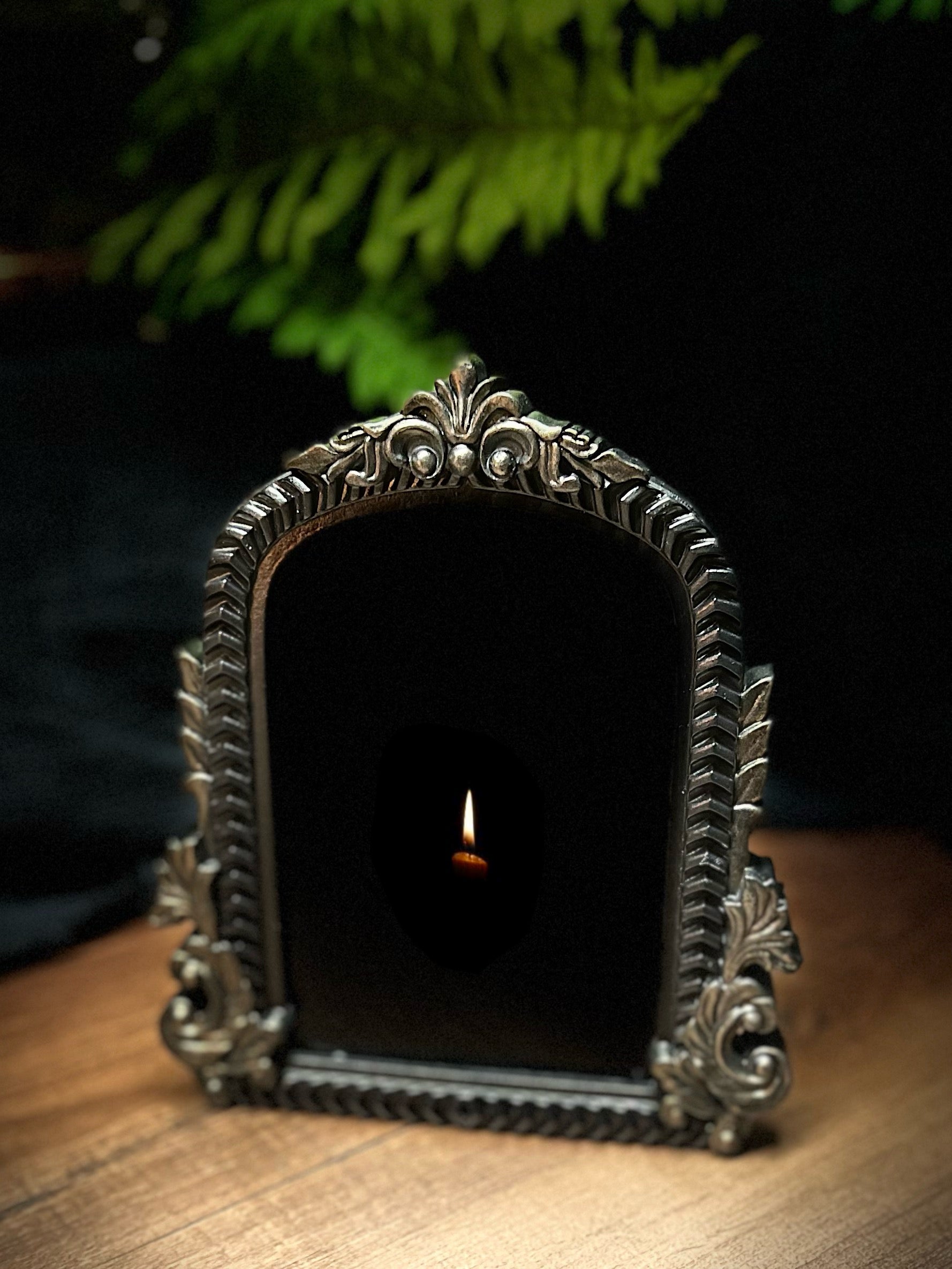 Small Fancy Black Scrying Mirror Ornate Scrolls Black and Bronze Detail on a Witch’s Altar Divination Magickal Mirror