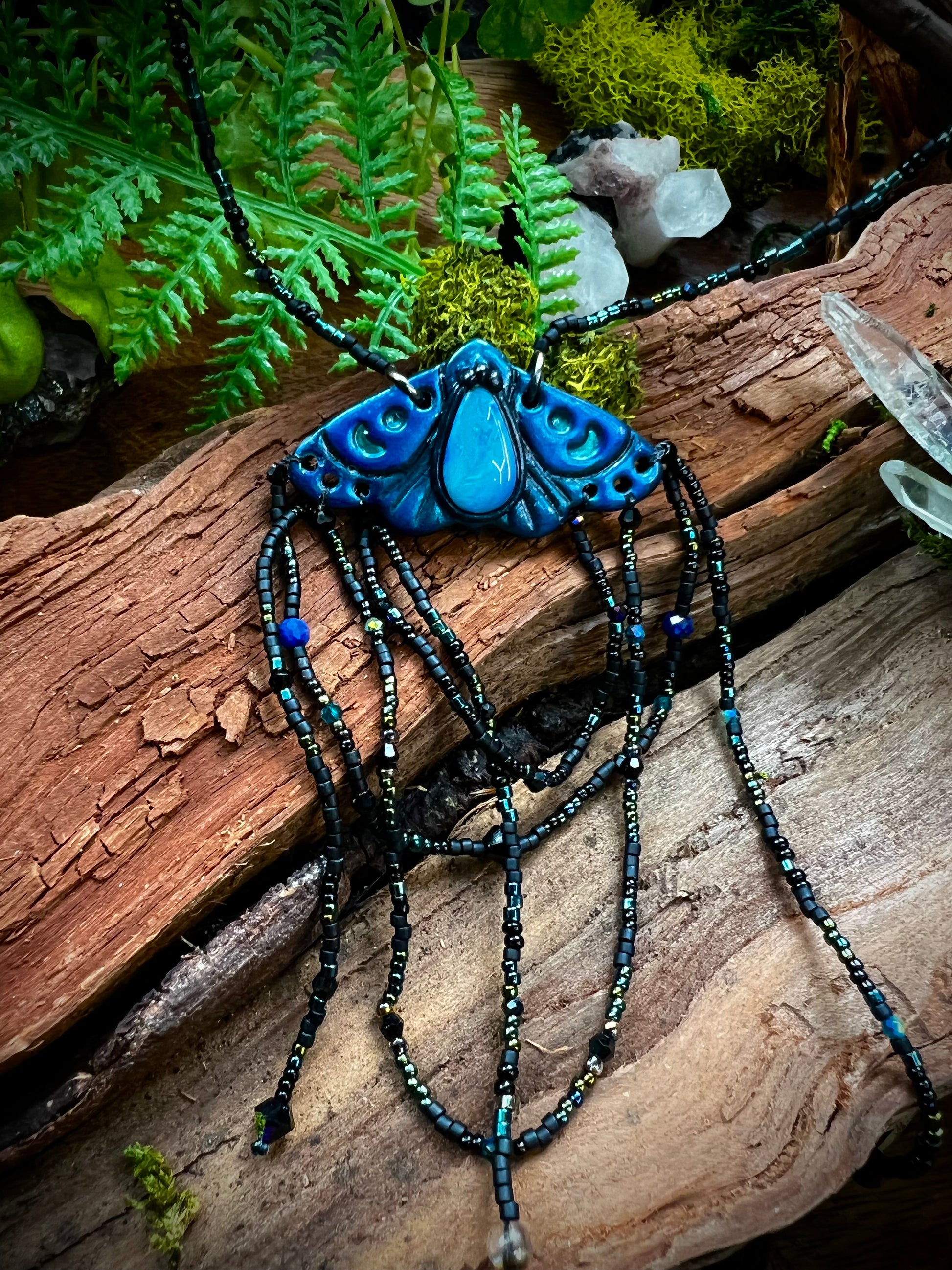 Artisan moth statement necklace symbolizing transformation and divine connection