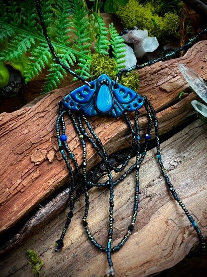 Artisan moth statement necklace symbolizing transformation and divine connection