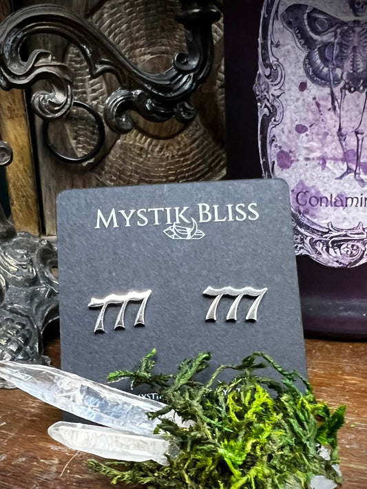777 angel number stud earrings on Mystik Bliss card with quartz crystals and moss