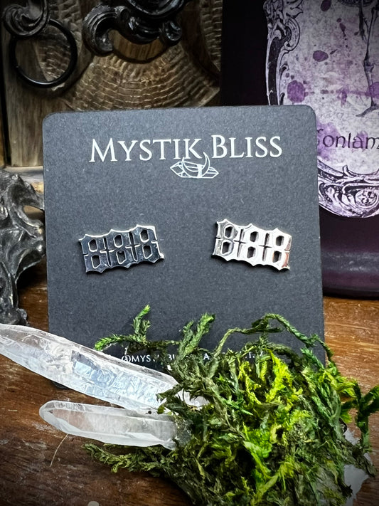 888 angel number stud earrings on Mystik Bliss card with quartz crystals and moss