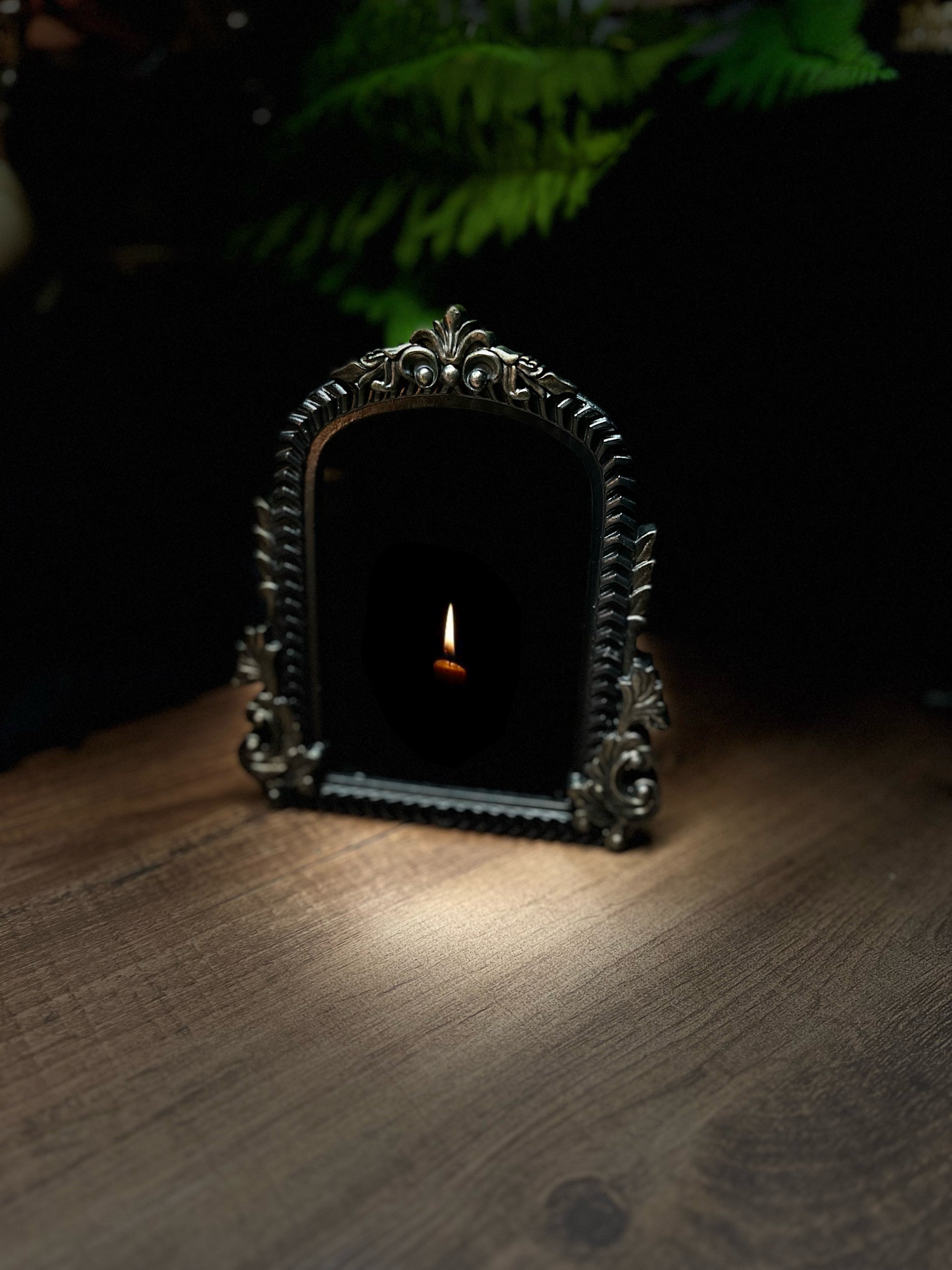 Small Fancy Black Scrying Mirror Ornate Scrolls Black and Bronze Detail on a Witch’s Altar Divination Magickal Mirror