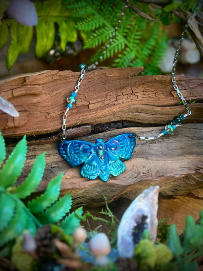 Moonlit moth pendant necklace styled in forest-inspired setting