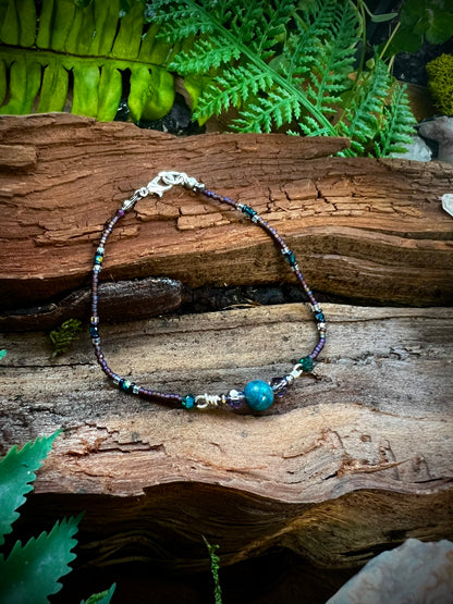 Mystical apatite gemstone bead glowing in bracelet design