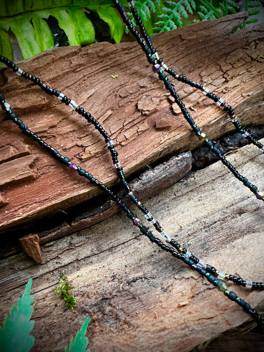 Two variations of aurora seed bead necklaces, patterned and random