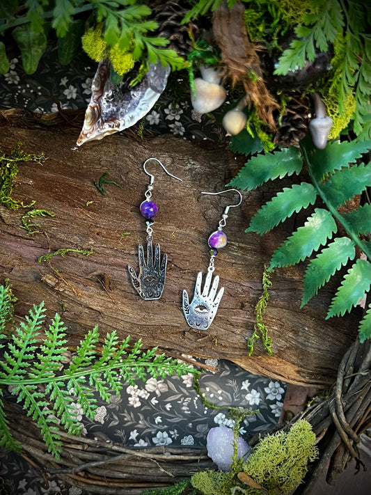 Mystic protection earrings featuring silver hand charms and vibrant glass beads