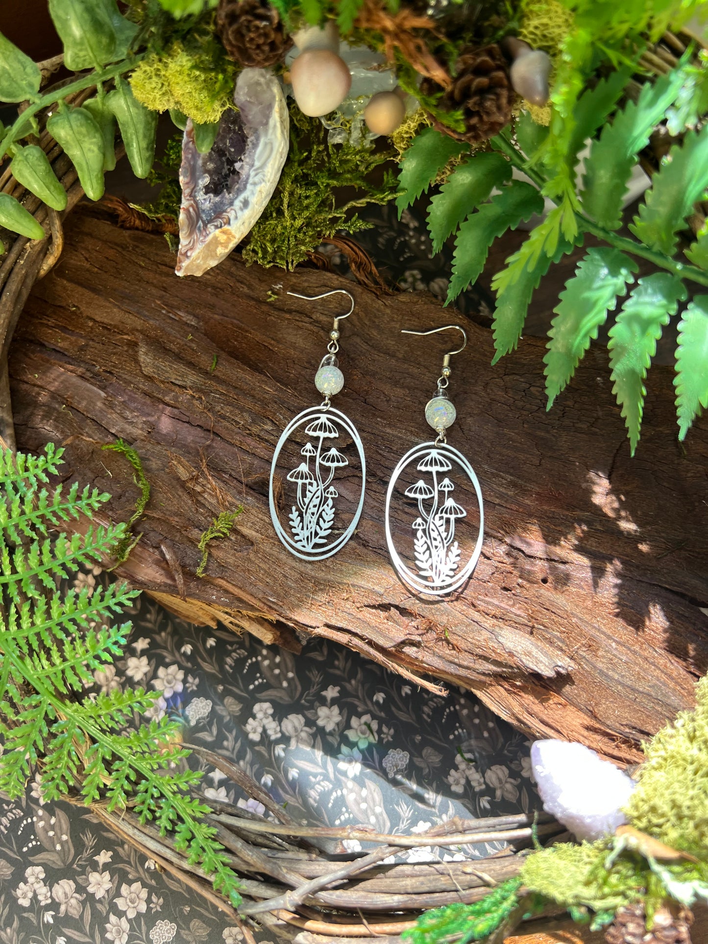 Mystical mushroom earrings featuring iridescent aura crackle quartz and woodland charm