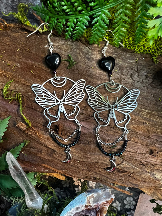 Sparkling black agate moon moth earrings with crescent moons and beadwork on wood