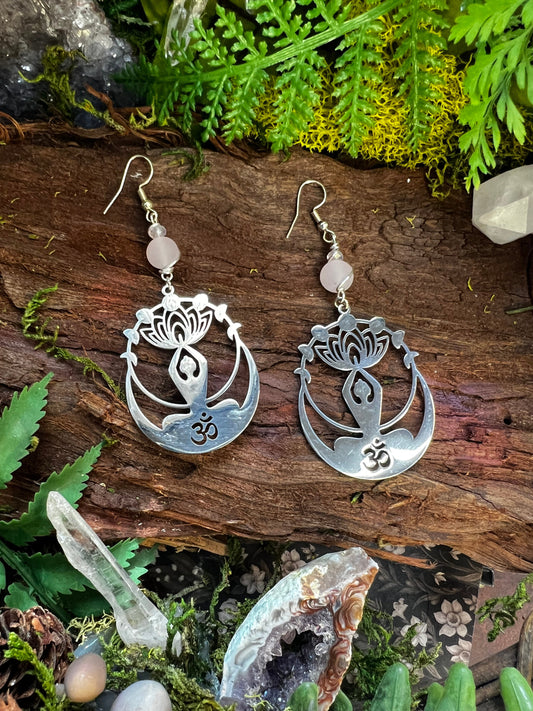 Rose quartz and clear quartz Om earrings with lotus and moon design on moss and wood