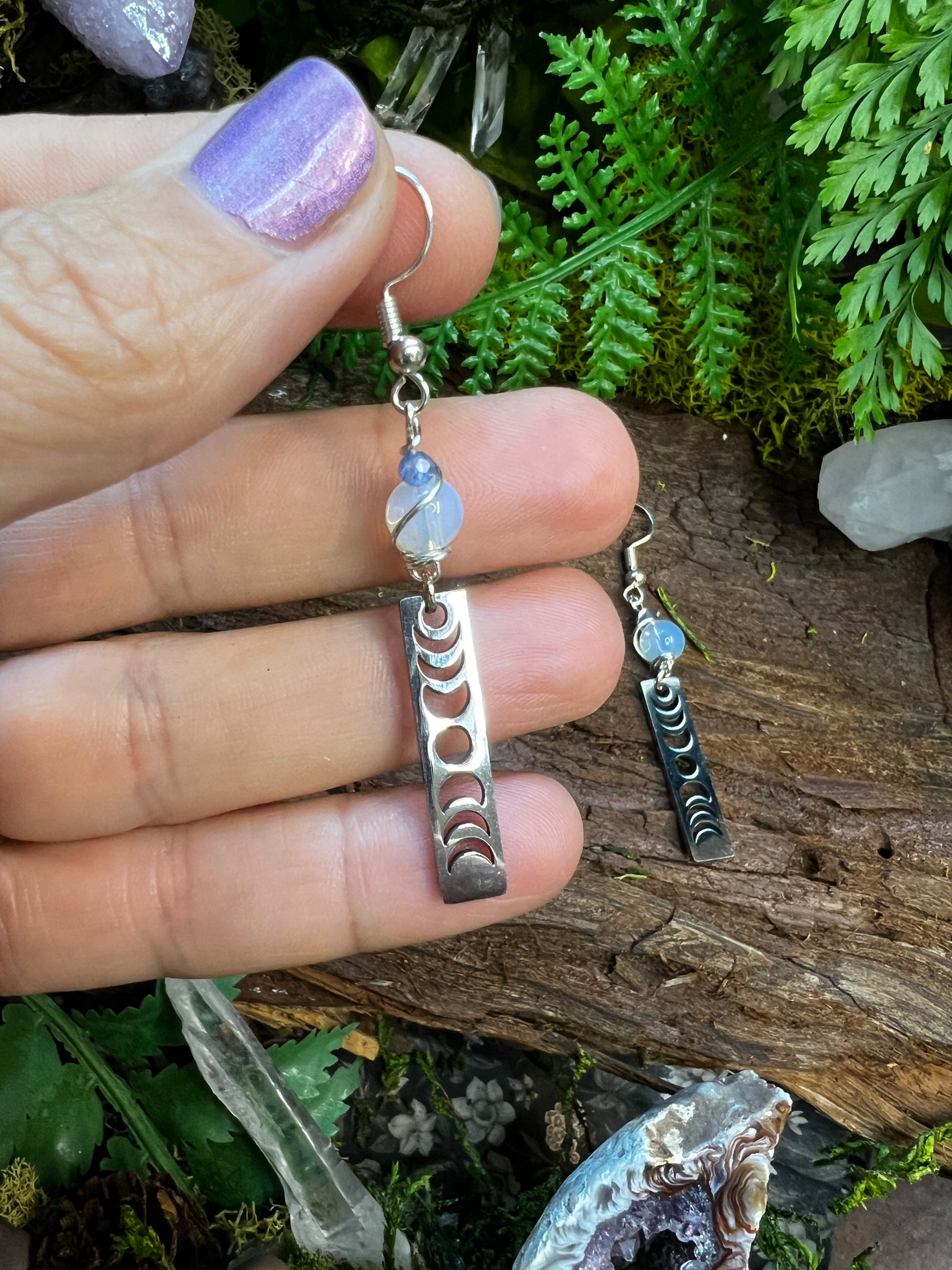 Mystical moon phase earrings with glowing opalite and soothing kyanite on rustic wood
