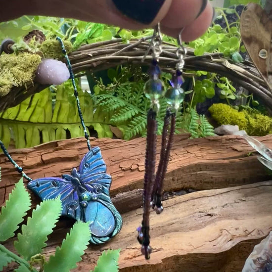 Handcrafted fairycore fringe earrings in purple, black, and iridescent hues