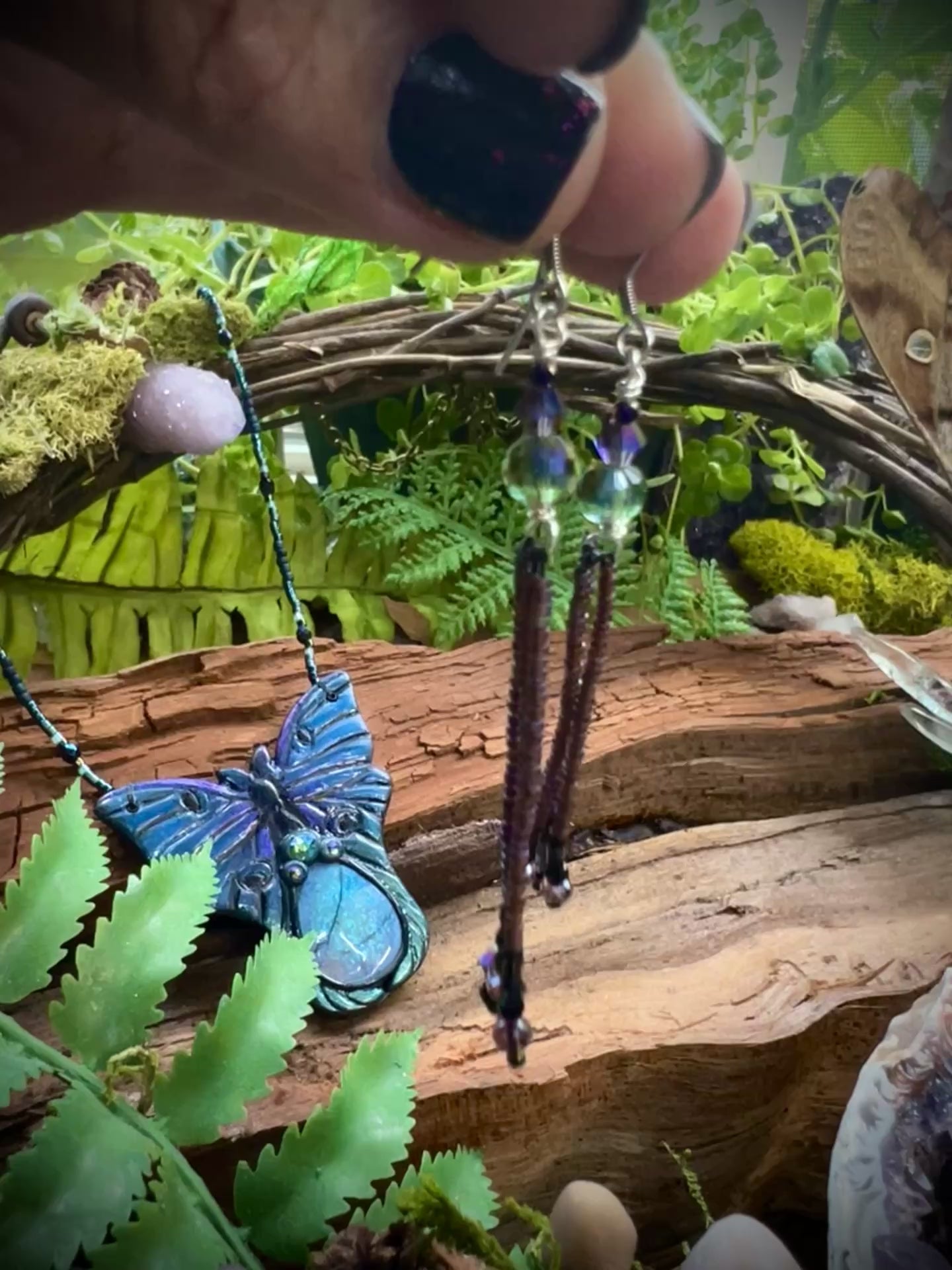 Handcrafted fairycore fringe earrings in purple, black, and iridescent hues