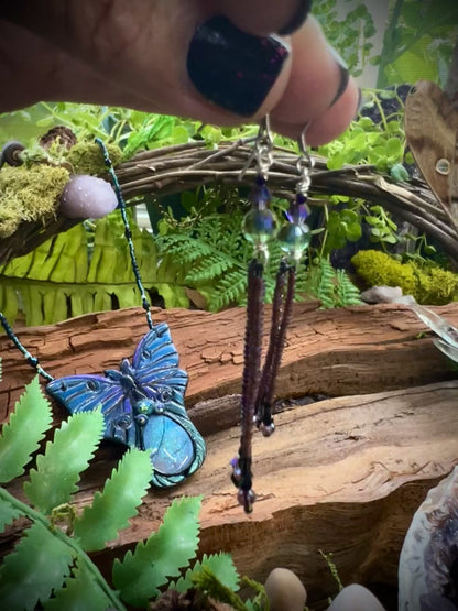 Handcrafted fairycore fringe earrings in purple, black, and iridescent hues