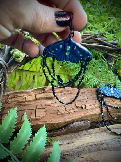 Hand-sculpted polymer clay moth earrings with crescent moon wing details