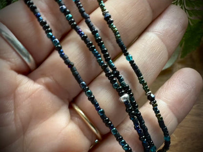 Group shot of 4 Moonlit Dreams Seed Bead Necklaces – dainty layering strands with aurora crystals