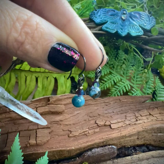 Close-up of ocean-blue apatite beads glowing with crystal shimmer