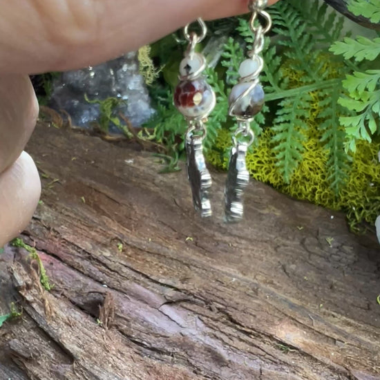 Lightweight agate earrings with Metatron charms surrounded by moss and crystals