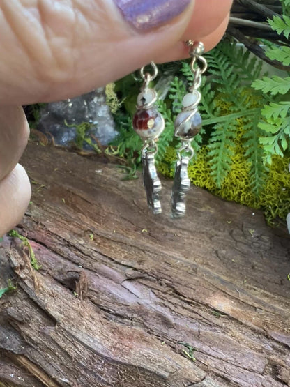 Lightweight agate earrings with Metatron charms surrounded by moss and crystals